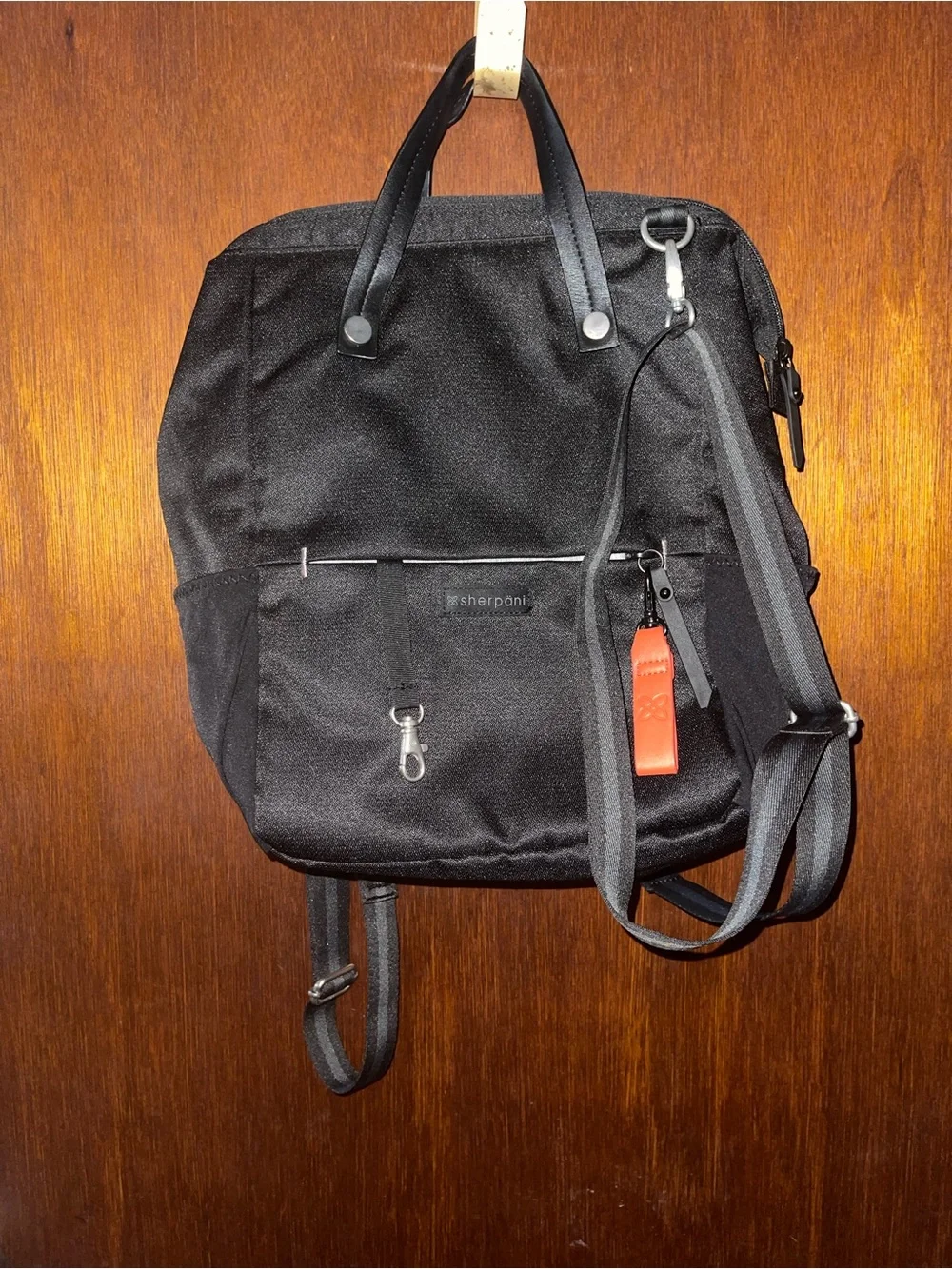 Sherpani Black Backpack with Orange Accent
